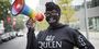 Kendall Stephens wearing a sweatshirt and matching face mask that says "QUEEN" with a rainbow megaphone.