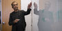 Professor Sudhir Kumar at the white board teaching a small seminar class