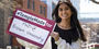 Image of Areebah Rahman outside holding a Temple Made for sign.