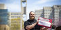 Image of Jake Horoshko standing in front of the Bell Tower. 