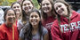 Temple students wearing Temple logo gear.