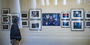  Image of a photo exhibit in a white room on the first floor of Charles Library at Temple University. 