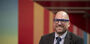 Dustin Kidd wearing blue glasses 