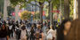 A campus scene of lots of students.
