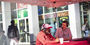 Image of a red canopy tent outside of Maxi’s Pizza, Subs and Bar on campus. 