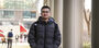 Edmond Tsan walks through campus