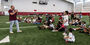 Image of Timothy Welbeck addressing the crowd at the Family Field Day event.