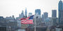 American flag against Philadelphia skyline