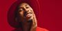 Kalen Allen posing in red.