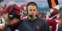 Rhule on the sidelines wearing a game headset