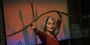 Merián Soto holding branches as part of her choreography