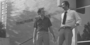 Image of two people walking down the steps of Tomlinson Theater.