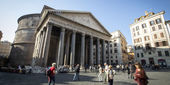 People walk past the Pantheon in Rome.