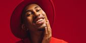 Kalen Allen posing in red.