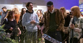 A Temple student presenting the exhibit at the 2025 Philadelphia Flower Show