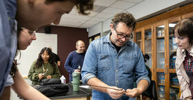 Sam Van Aken working with students