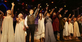 Image of the cast of Goblin Market performing on stage.