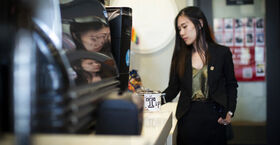 STHM faculty member Lu Lu pictured giving a tip.