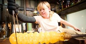 Image of Gemma Hollister creating a glass hamster tube on the set of Blown Away.