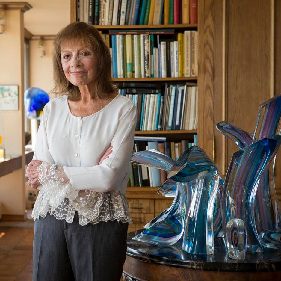  Laurie Wagman in her home with the glass piece Blue Spray, by Harvey Littleton.